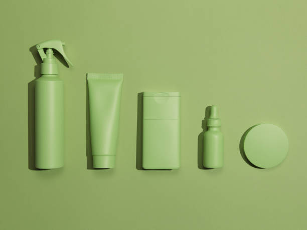 Flat lay photo of hand-painted beauty products in monochrome green color